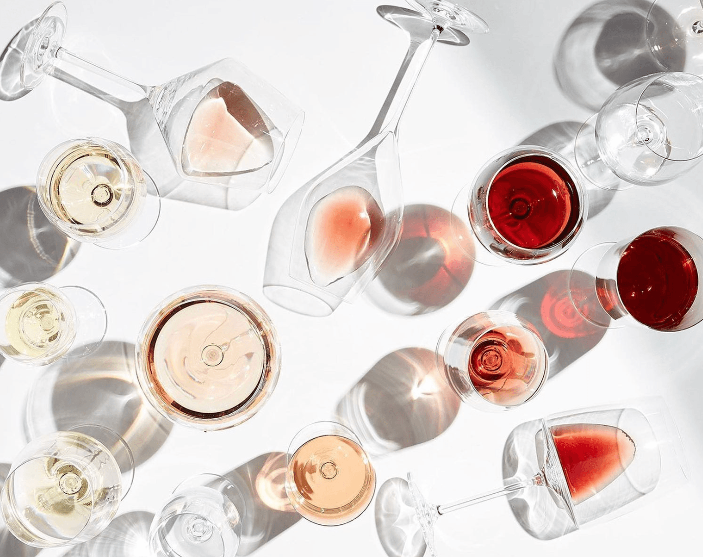 A flight of wine glasses in warm light